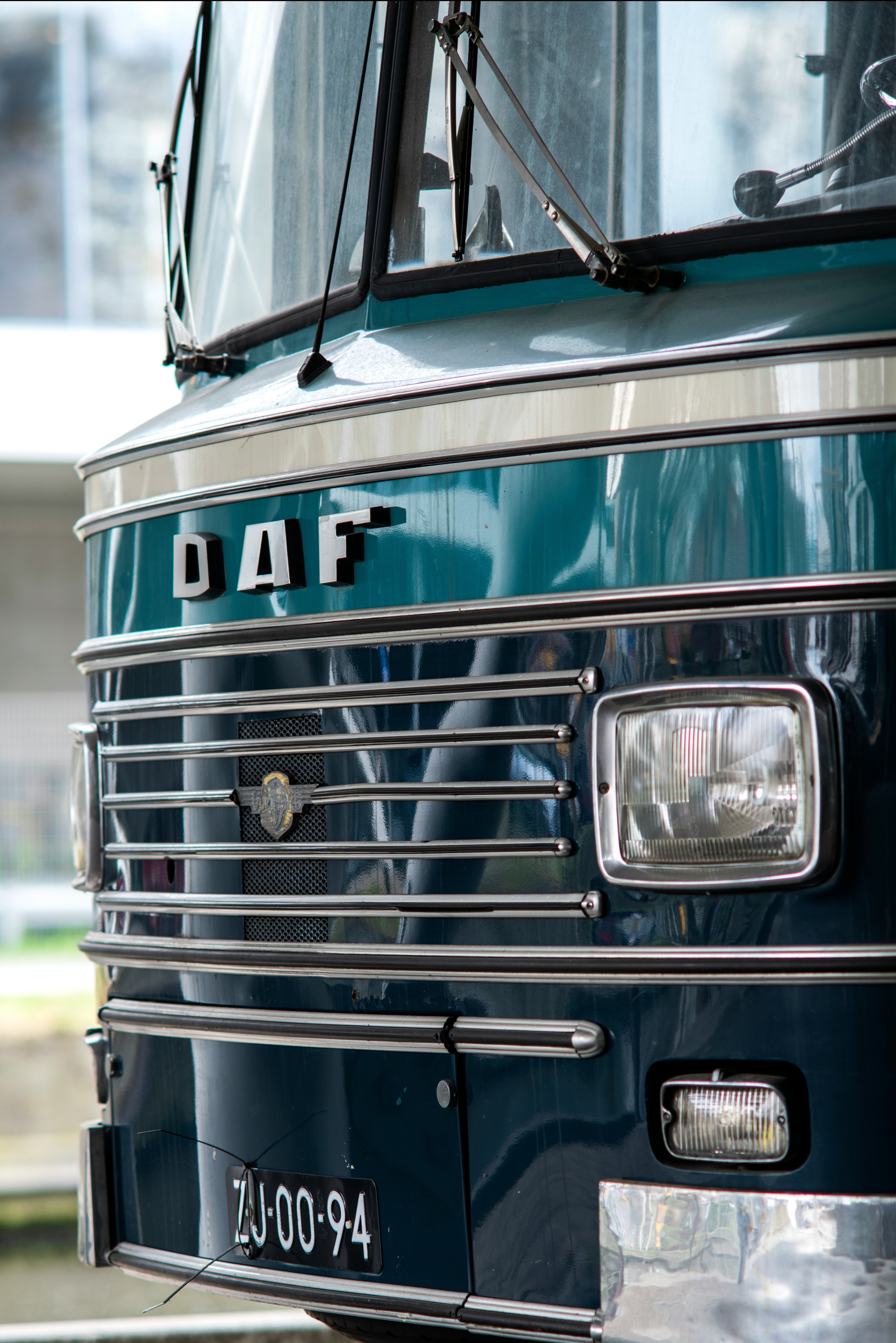 Blue bus with "DAF" on the grill - image by Lucas Van Oort - Unsplash