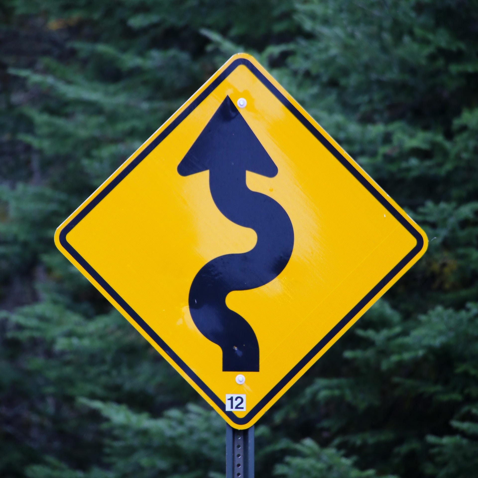 curves ahead sign photo by mark konig unsplash